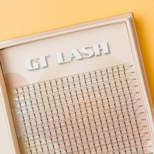 A box of GT Lash brand false eyelash extension fans, featuring 7D premade long stem wispy volume lash fans