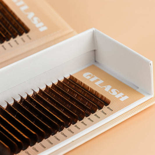Brown ellipse lash extensions in classic tray – soft flat lashes for natural-looking sets by GT Lash Co