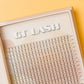 A box of GT Lash brand false eyelash extension fans, featuring 7D premade long stem wispy volume lash fans