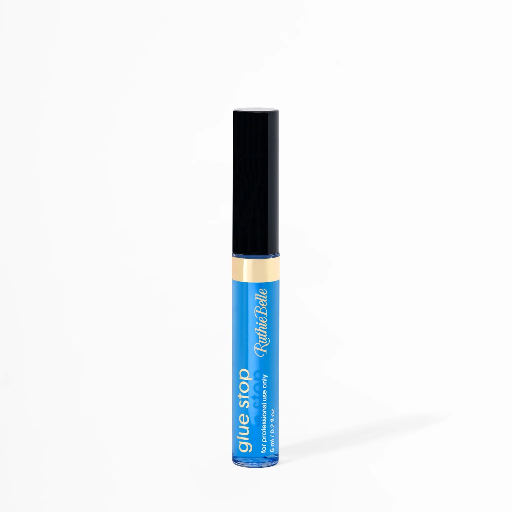 A bottle of Glue Stop by GT Lash Co, a lash artist's adhesive control solution, with a black cap and blue label.