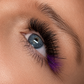 Close-up of colored lash extensions applied to outer corner with black volume premade fans, ChromaCrush colored lash trays by GT Lash Co